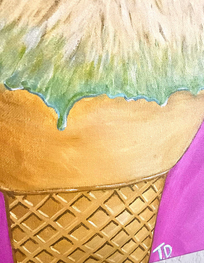 Close up of cone with green sauce dripping from fur on a pink background