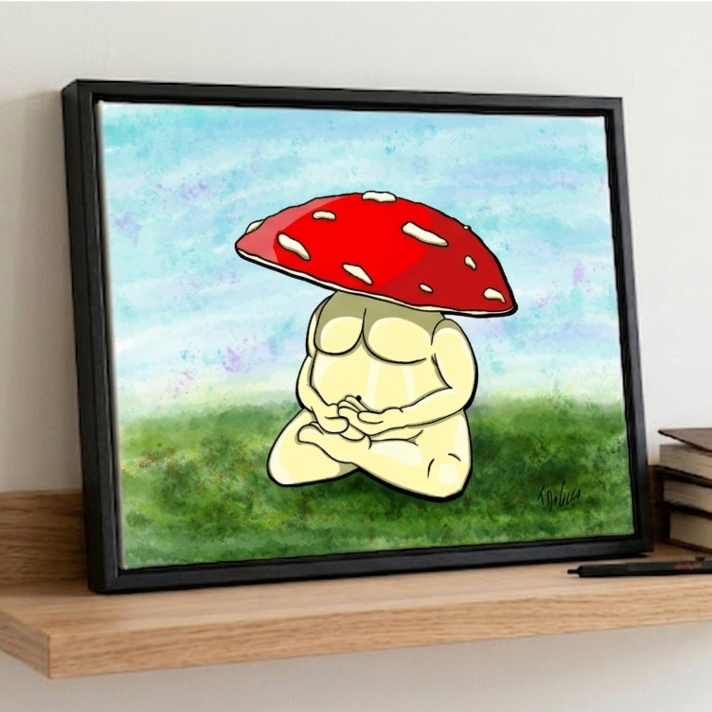 The Meditating Mushroom framed print on a studio shelf, ideal wellness gift for creatives.