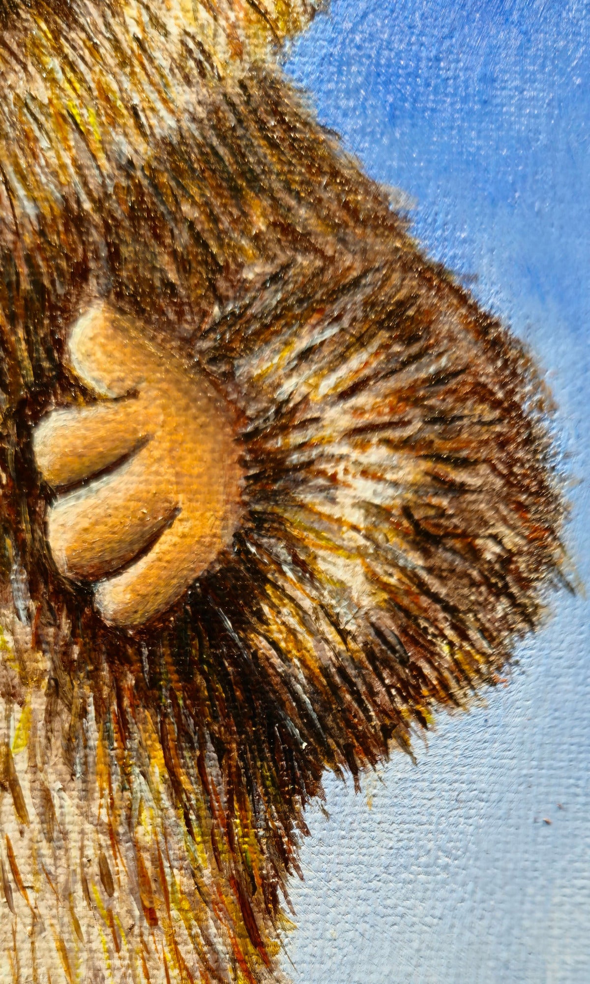 Close-up of a Salary Daddy Labubu's arm with detailed fur texture against a blue background